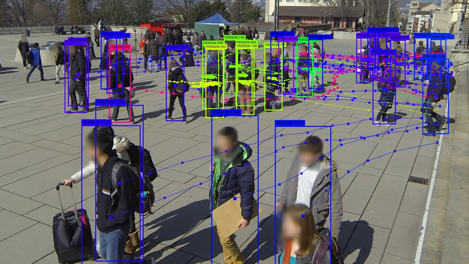 A still image from Wildtrack dataset collected at EHZ Zurich, where researchers recorded students and publicly distributed their videos for surveillance research. The image is anno