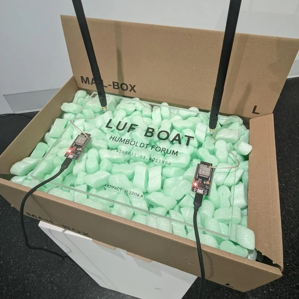 Two SkyLift devices (IoT microcontrollers) with 13dbi gain antennae broadcasting wireless geolocation signals acquired from the Humboldt Forum in Berlin. Photo: © !Mediengrupp